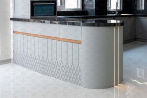 جزیره آشپزخانه با طراحی منحنی و صفحه رویی سنگ مشکی